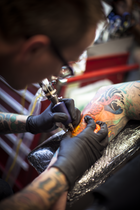 Tim Dywelska at work in his Melbourne tattoo studio